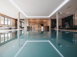 an empty swimming pool in a building at VAYA Zillertal in Aschau