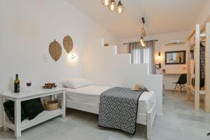 Кровать или кровати в номере Casa Verde Di Naxos