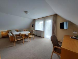 Un televizor și/sau centru de divertisment la Landhaus Waldeshöhe
