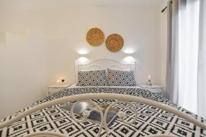 Кровать или кровати в номере Casa Verde Di Naxos