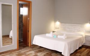 Postel nebo postele na pokoji v ubytování Te Maná Hotel
