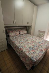 A bed or beds in a room at FLAT BIBIONE
