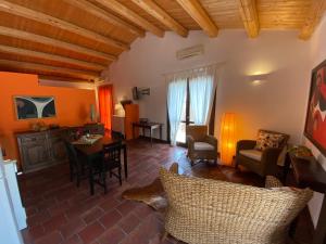 a living room with a couch and a table at Orecchie di Lepre in Siracusa +31 photos