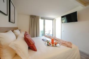 Łóżko lub łóżka w pokoju w obiekcie Bergamo Inn 15