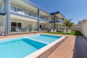 Bazén v ubytování Residence Meridian Unità 5 nebo v jeho okolí