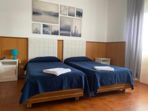 Posteľ alebo postele v izbe v ubytovaní Residence Hotel Valery