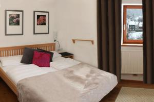 Кровать или кровати в номере Biotel Bertel Naturappartements