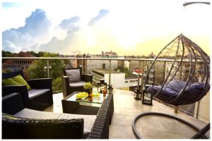 a balcony with a hammock on a roof at LUXURIOUS APARTMENTS by NOOK NOOK in Krakow