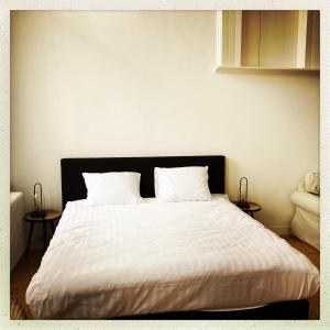 Een bed of bedden in een kamer bij Cleen Rochelle