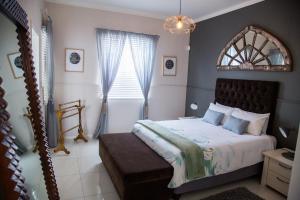 Llit o llits en una habitació de Mahdi Cottage