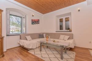 a living room with a couch and a table at Apartment Alen in Makarska