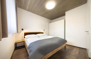 Posteľ alebo postele v izbe v ubytovaní Apartmány Panelka Costa Plana Lipno