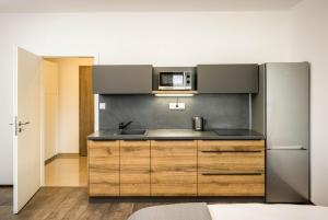 Kuchyňa alebo kuchynka v ubytovaní Apartmány Panelka Costa Plana Lipno