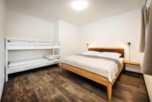 Posteľ alebo postele v izbe v ubytovaní Apartmány Panelka Costa Plana Lipno
