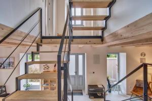 a staircase in a house with wooden beams at Casa Santa Maria Vacation House in Mali Lošinj