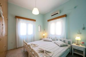 Posteľ alebo postele v izbe v ubytovaní Eirinis house with amazing view in Masouri Kalymnos