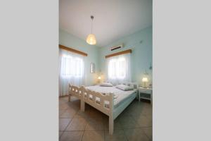 Posteľ alebo postele v izbe v ubytovaní Eirinis house with amazing view in Masouri Kalymnos