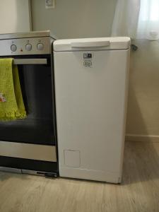 Kuchyňa alebo kuchynka v ubytovaní Porto Plaza City Center Apartment AC/Wifi