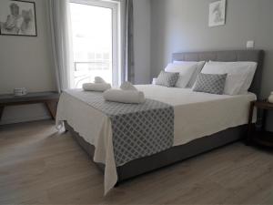 Posteľ alebo postele v izbe v ubytovaní Porto Plaza City Center Apartment AC/Wifi