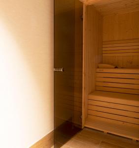 a sauna with a glass door in a room at Goodnight Cádiz Apartments in Cádiz