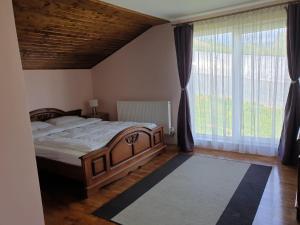 Postel nebo postele na pokoji v ubytování Lidia House