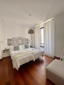 Cama o camas de una habitación en La Casa de la Alameda