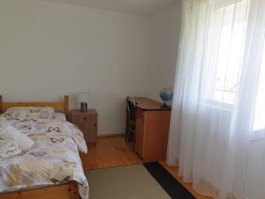 Postel nebo postele na pokoji v ubytování Lidia House