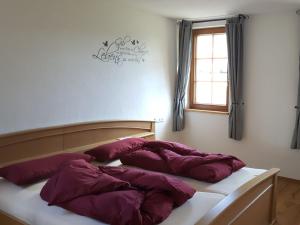 Säng eller sängar i ett rum på Fischerhof