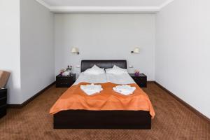 Postel nebo postele na pokoji v ubytování HOTEL OPAL Zalau