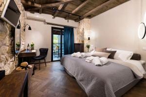 Posteľ alebo postele v izbe v ubytovaní Tsikeli Boutique Hotel Meteora - Adults Friendly