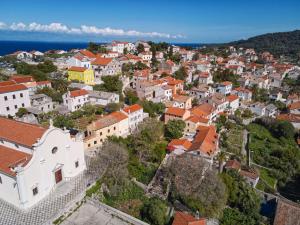 an aerial view of a town with orange roofs at Casa Santa Maria Vacation House in Mali Lošinj