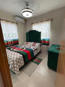 a bedroom with two beds and a table at Penthouse with private rooftop near the airport. in La Javilla