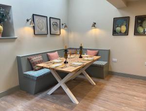 a dining room with a table and chairs at Rectory Farm Barn in Grantham