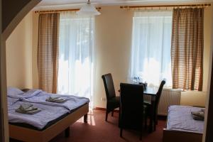 Posteľ alebo postele v izbe v ubytovaní Pensjonat 4 Pory roku