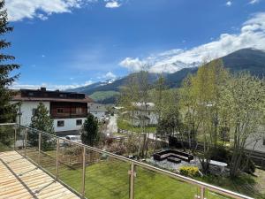 a balcony with a view of the mountains at Apartments Garden House in Niedernsill