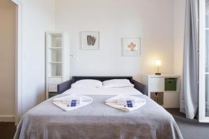 Un ou plusieurs lits dans un hébergement de l'établissement Nice studio with sea view & balcony - Biarritz - Welkeys
