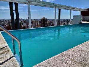 Bazén v ubytování Departamentos Illia By Lugar nebo v jeho okolí
