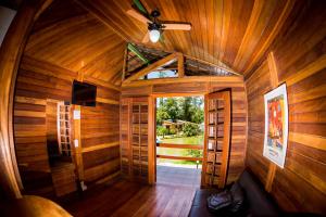 an inside view of a wooden cabin with a door at Pousada Suarez in Penedo