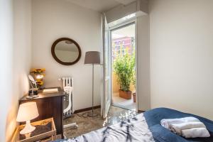 Postel nebo postele na pokoji v ubytování Milano Guest House