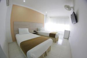 TV a/nebo společenská místnost v ubytování Vajamar Hotel
