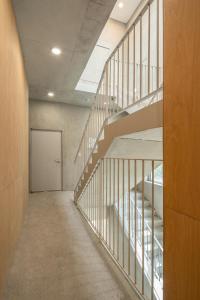 an empty hallway with stairs in a building at Laon on 37 in Tongyeong