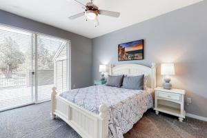 a bedroom with a white bed and a ceiling fan at Eagle Crest Modern Escape in Redmond +29 photos
