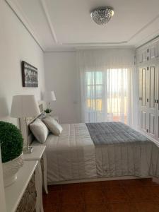 A bed or beds in a room at Duplex Penthouse Panoramic Del Atlantico