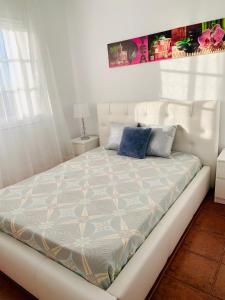 A bed or beds in a room at Duplex Penthouse Panoramic Del Atlantico