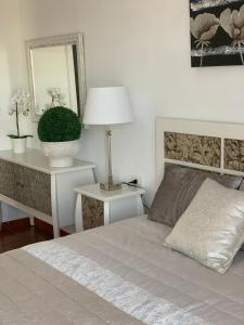 A bed or beds in a room at Duplex Penthouse Panoramic Del Atlantico