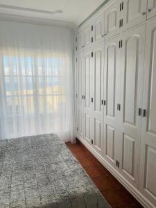 A bed or beds in a room at Duplex Penthouse Panoramic Del Atlantico