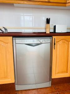 A kitchen or kitchenette at Duplex Penthouse Panoramic Del Atlantico