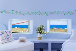 A bed or beds in a room at Windmill Villas