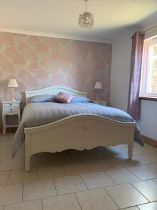 a bedroom with a large bed in a room at Ard Na Mara Self Catering Isle of Mull in Dervaig