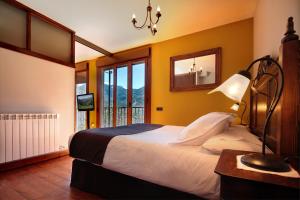 Postel nebo postele na pokoji v ubytování Villa de Plan Apartments&Suites